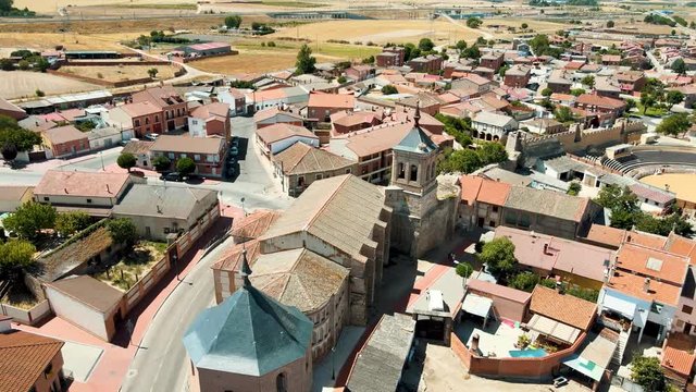 Aerial view of a church surrounded by houses in town. From a drone, in 4k. 