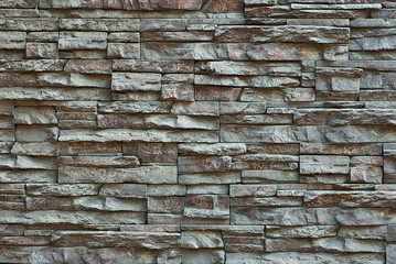 Texture of brick wall and concrete blocks. Samples of stone plates stacked evenly in a row.