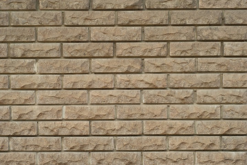 exture of brick wall. new brickwork. Samples of wall or fence are presented at exhibitions. Brown brick close up.