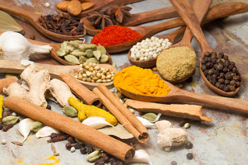 Aromatic spices on wooden spoons. Food ingradients.


