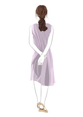 後ろで手を組み立つ若い女性