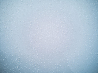 Rain drops on car window glasses surface. Natural Pattern of raindrops.