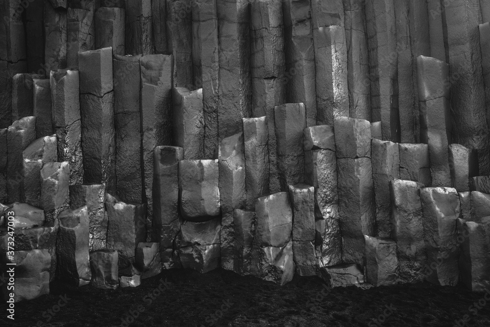 Poster grayscale shot of basalt columns