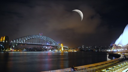 sydney harbour bridge at night with Quarter Moon