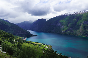 Fototapeta na wymiar Famous Norwegian Fjord in the summer. Beautiful blue water. Aurlandsfjorden