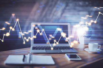 Forex market chart hologram and personal computer background. Multi exposure. Concept of investment.