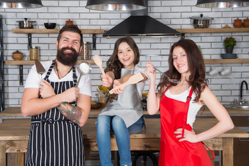 Happy family cooking holiday meals together, culinary recipe concept