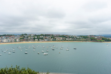 view of the city of San Sebastian, with La Concha beach, from Mount Urgull. Summer vacation scene in Spain