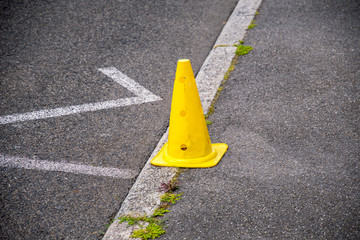 yellow warning cap on the road