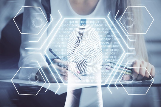 Blue fingerprint hologram over woman's hands taking notes background. Concept of protection. Double exposure