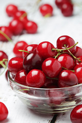 A small glass bowl with ripe fresh cherry