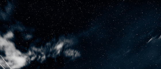 Obraz na płótnie Canvas Stars and sky with clouds at night, interstellar, galaxy