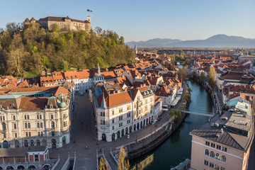 Aerial drone panoramic view of Ljubljana, capital of Slovenia in warm afternoon sun.