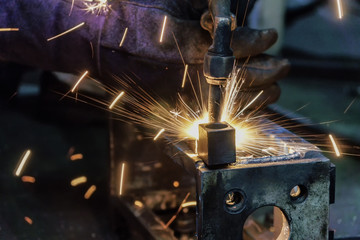 Industrial robot is welding assembly automotive part in factory