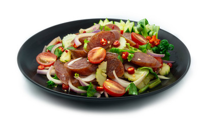 Spicy Chinese Sausage Salad (Yum Kun Chiang) with cucumber and vegetables Thai food