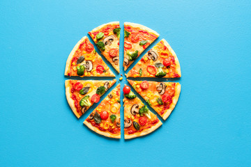 Pizza primavera slices top view. Vegetarian pizza flat lay. Sliced pizza.