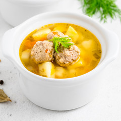 Healthy homemade meatball soup. Space for text.