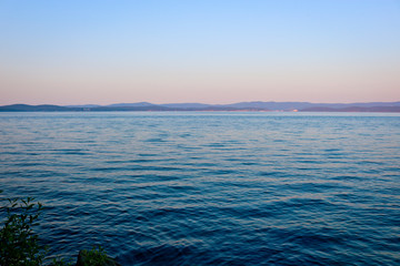 Obraz premium Lake in the evening light. Calm, clear water. The purest lake Turgoyak, Russia.