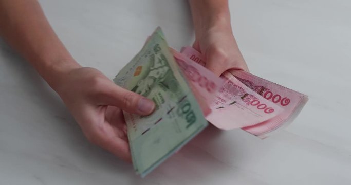 Count Thai Bht banknote on hand