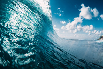 Crashing perfect blue wave. Breaking surfing wave, power of ocean