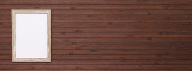 Empty wooden frame mockup on mahogany boards background. Mahogany wooden wall paneling background. Background concept for website.