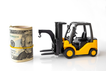 Mini forklift truck load stack of banknotes usa. Logistics, transportation, management ideas,...
