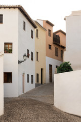 Cozy empty street in city center of Granada Spain summer evening