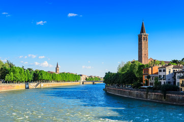View of Verona and the Bell tower of the church of Santa Anastasia and the Bell tower of the church of Saint Tommaso Cantuariense in the background from the Ponte Pietra bridge