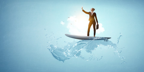 Business woman taking selfie on the waves