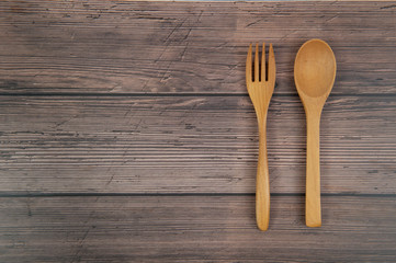 Wooden spoon and fork on table