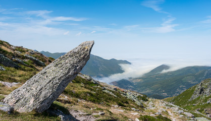 Flat stone floating on the mountain side