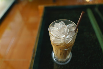 Cold ice milk coffee in glass cup