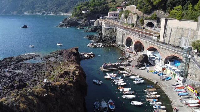 Europe, Italy , Liguria , Framura - drone aerial view of the walk the Way of the Sea or Via del Mare near Cinque Terre - Ciamia the biggest cliff of Liguria with the Modonnina and the  train station