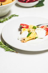 italian pasta salad on a white plate