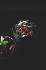 rice with vegetables in bowl on dark background