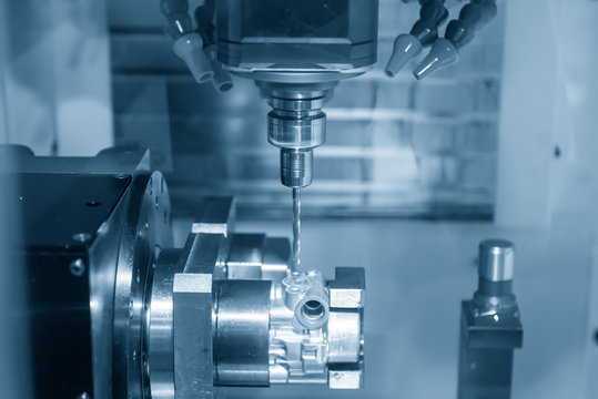 The CNC milling machine with rotary table machine the  aluminium automotive casting part . The automobile part manufacturing process by machining center with drilling tool.