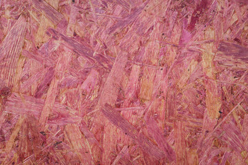The texture of the pressed panel made of wood shavings.