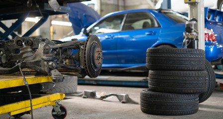 disassembled car parts in the auto workshop, machine service  station