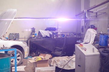 vintage old dusty car service workshop inside