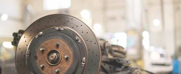 close up metal chrome brake disk, repair vehicle parts of the sport car