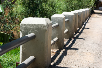 steel and concrete railing on a narrow bridge at the countryside