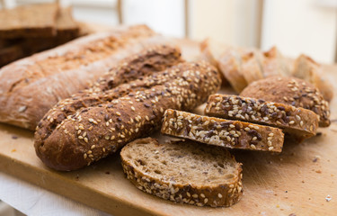 fresh loaf of bread on wooden board