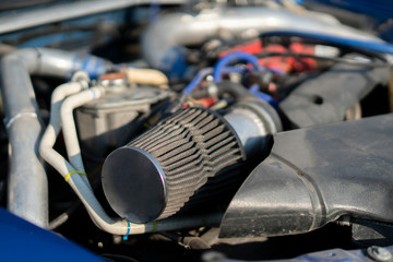 close up details in the motor engine of a vehicle sport racer car with opened hood