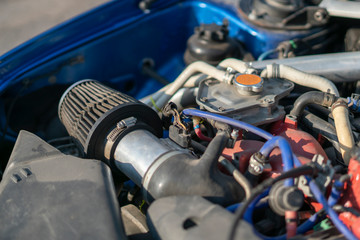 Fototapeta premium close up details in the motor engine of a vehicle sport racer car with opened hood