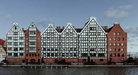 The old town of Gdansk in Poland and the motlawa river with beautiful old polish stile houses.