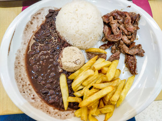 rice, beans, farofa, potato chips and meat bait