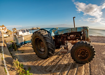 Fisheye view of a tractor, trailer and fishing boat on Cromer Beach on the North Norfolk Coast