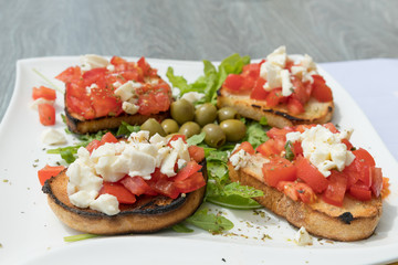 Bruschetta on a white plate