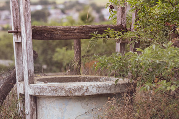 Old water fountain in a village in Romania. Selective focus