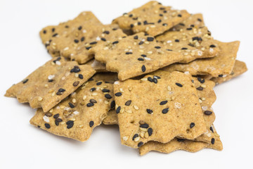 heap of spelt and lentil cracker with sesame and sea salt